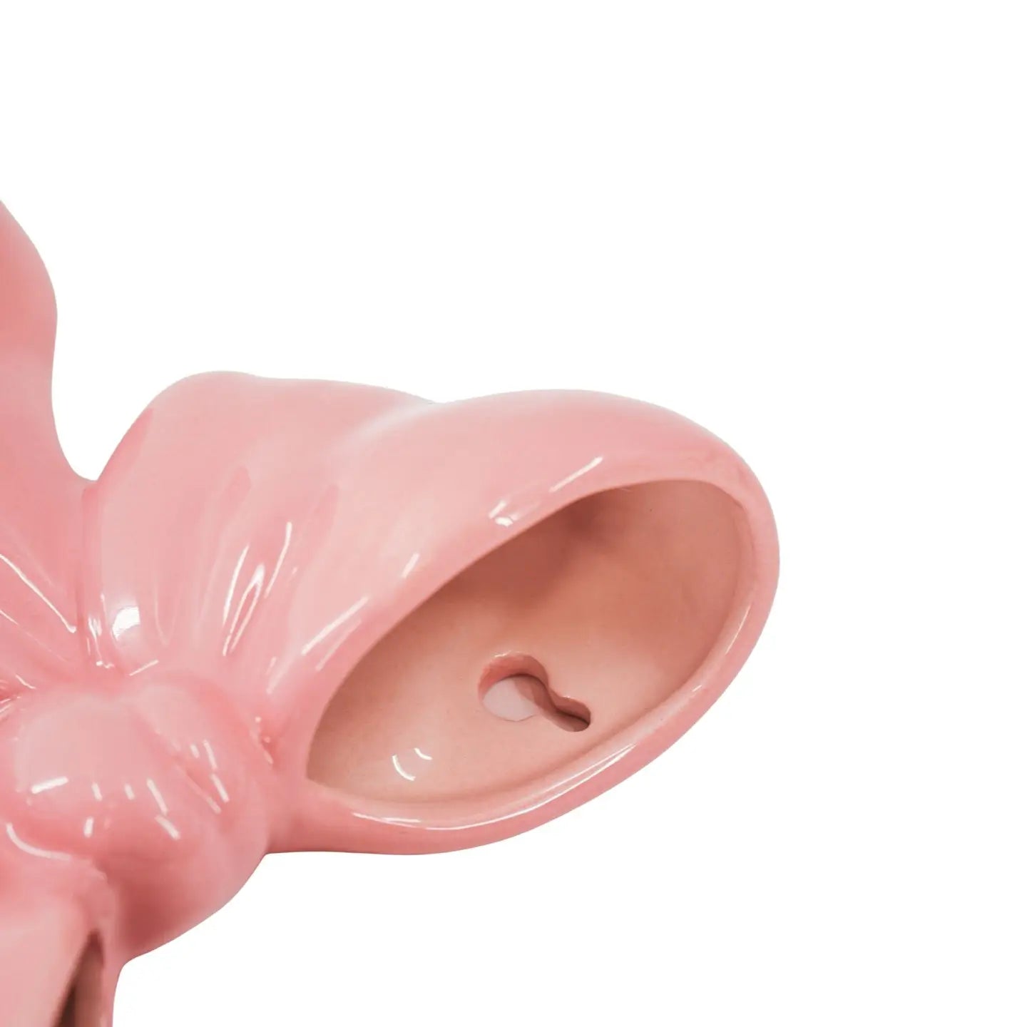 Wandvaas Strik. Vaas om op te hangen in de vorm van een strik. Roze