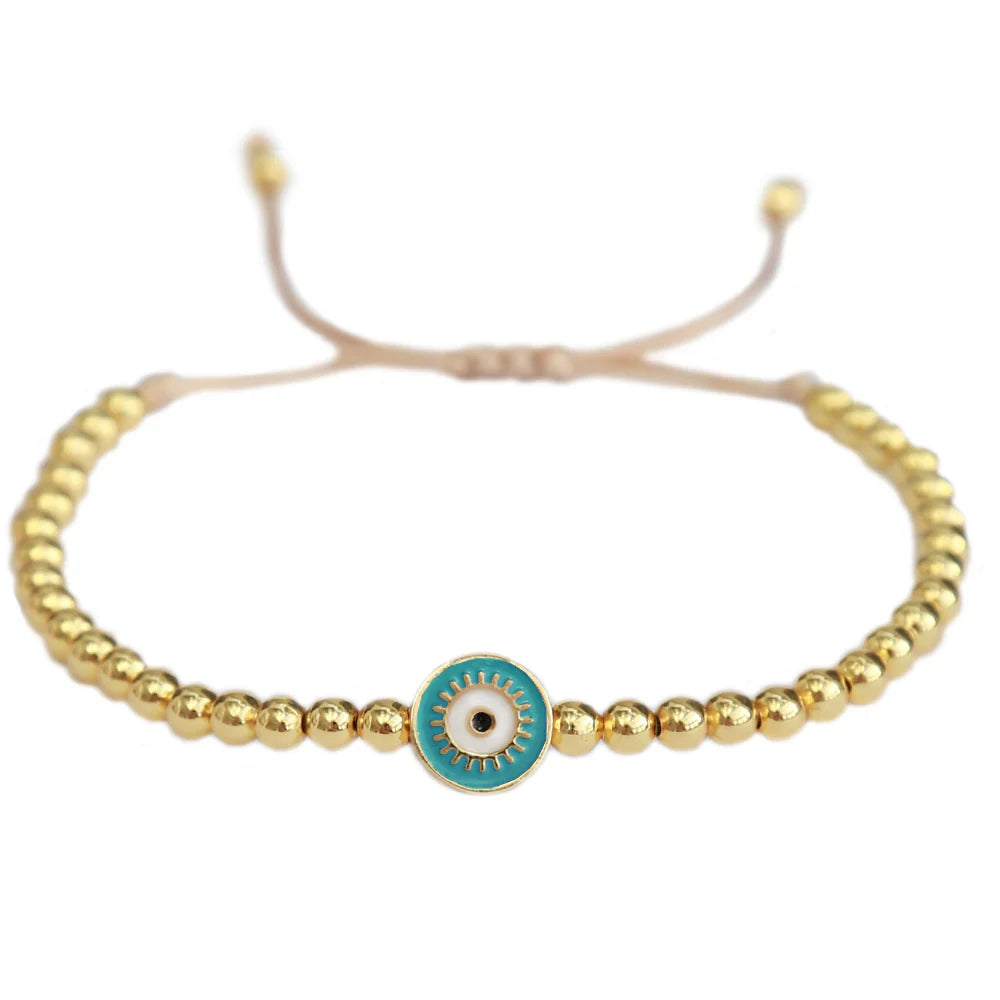 Love Ibiza armband. Gouden kralen met blauw evil eye 