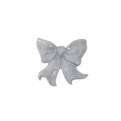 Wandvaas strik. Vaas om op te hangen in de vorm van een strik. Lila 