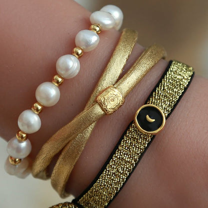 Love Ibiza armbanden. Parels met goud. 
