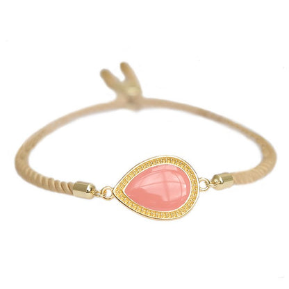 Love Ibiza armband Coral. Beige koord met bedel koraal met goud